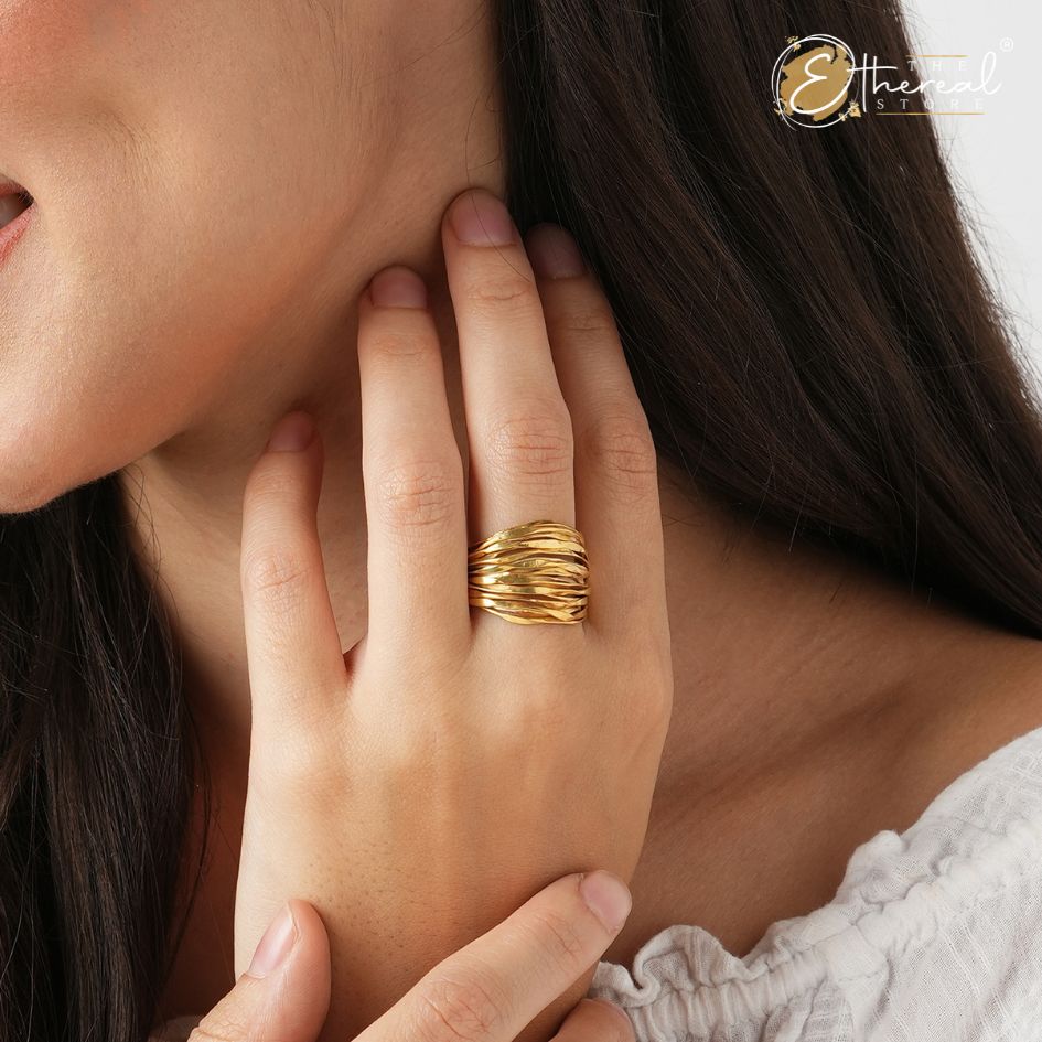 A close-up view of a sleek, metallic ring showcasing its bold design and intricate details.