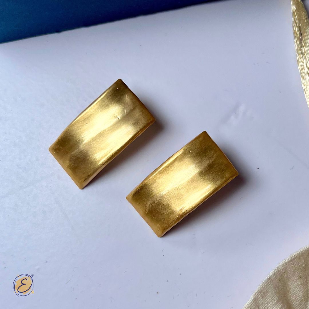 Singer Shirley Setia spotted in gold rectangle studs and gold arm cuffs