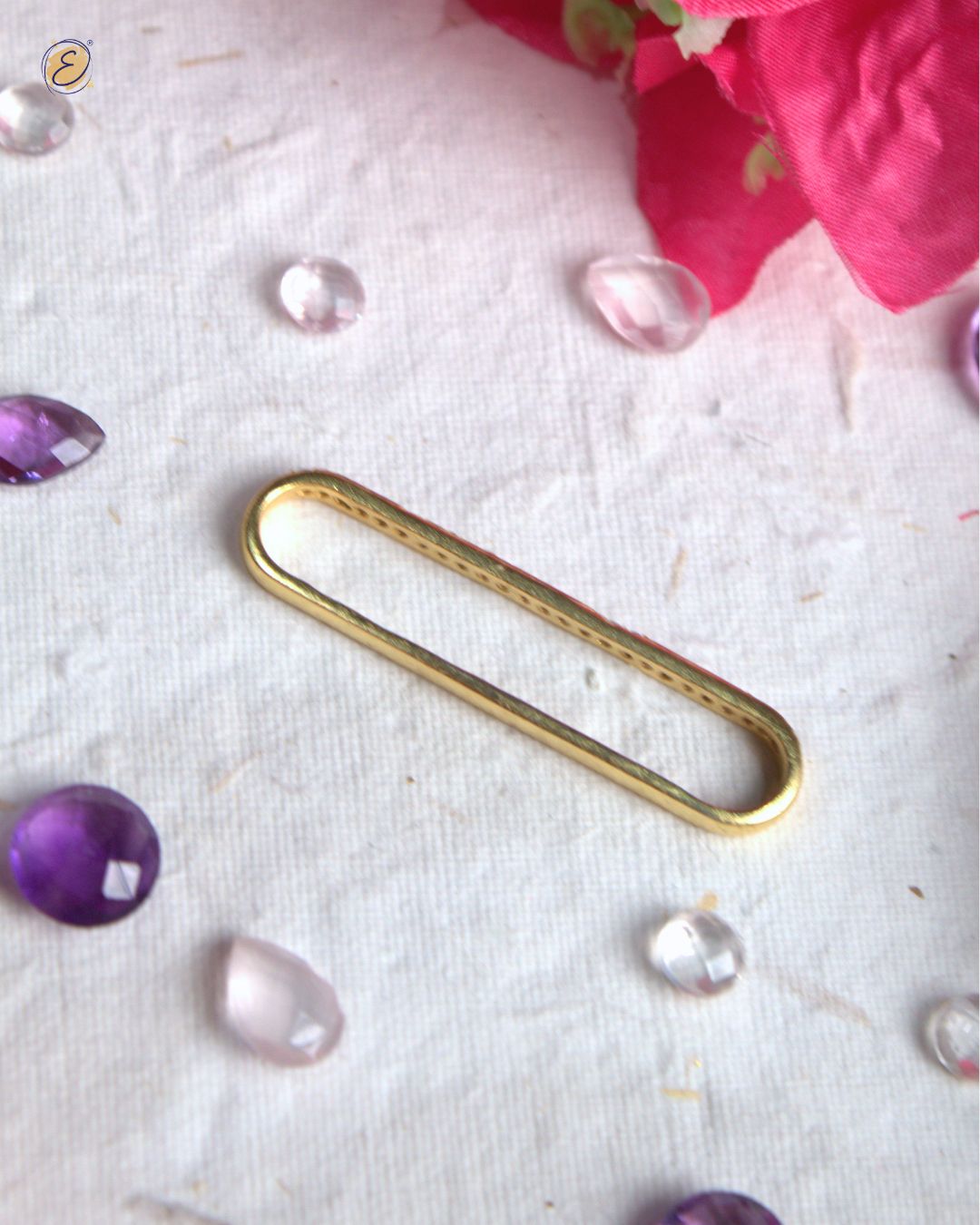 Gold-plated Amara earcuff with 25 rose quartz and amethyst stones, sleek and lightweight sparkle design.