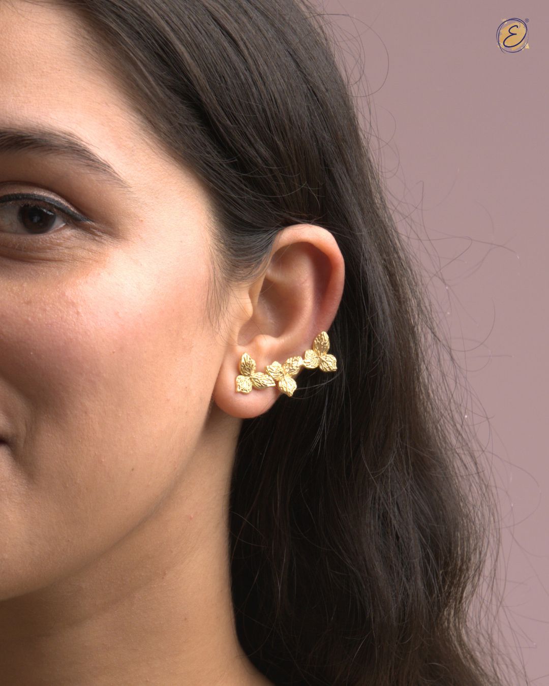 Gold-plated bougainvillea floral ear climber with three delicate flowers and U-clip, styled for festive wear.
