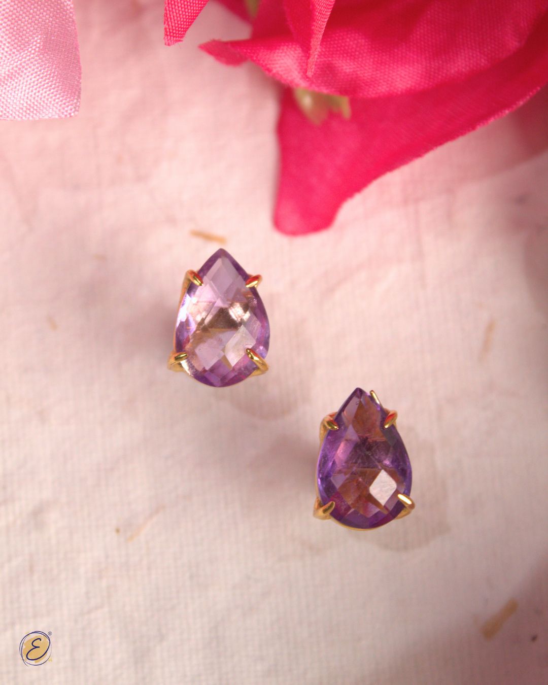 Gold-plated amethyst stud earrings with detachable bougainvillea sidekick charm for festive and versatile wear.