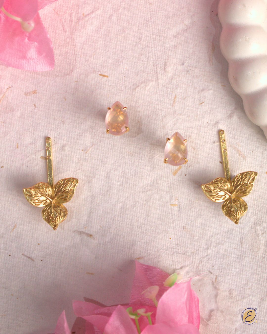 Gold-plated rose quartz stud earrings with detachable bougainvillea charm sidekick for versatile styling.