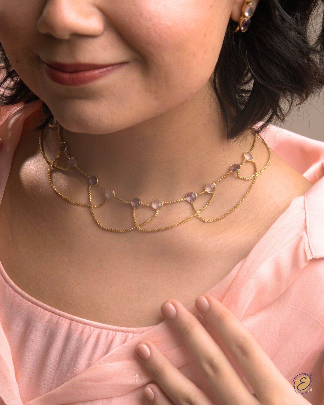 Gold-plated Jiya Cascade of Light Necklace with rose quartz and amethyst stones from The Ethereal Store’s Baagh collection.