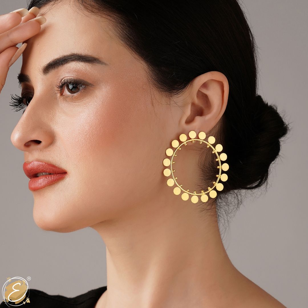 Gold earrings with a circular design