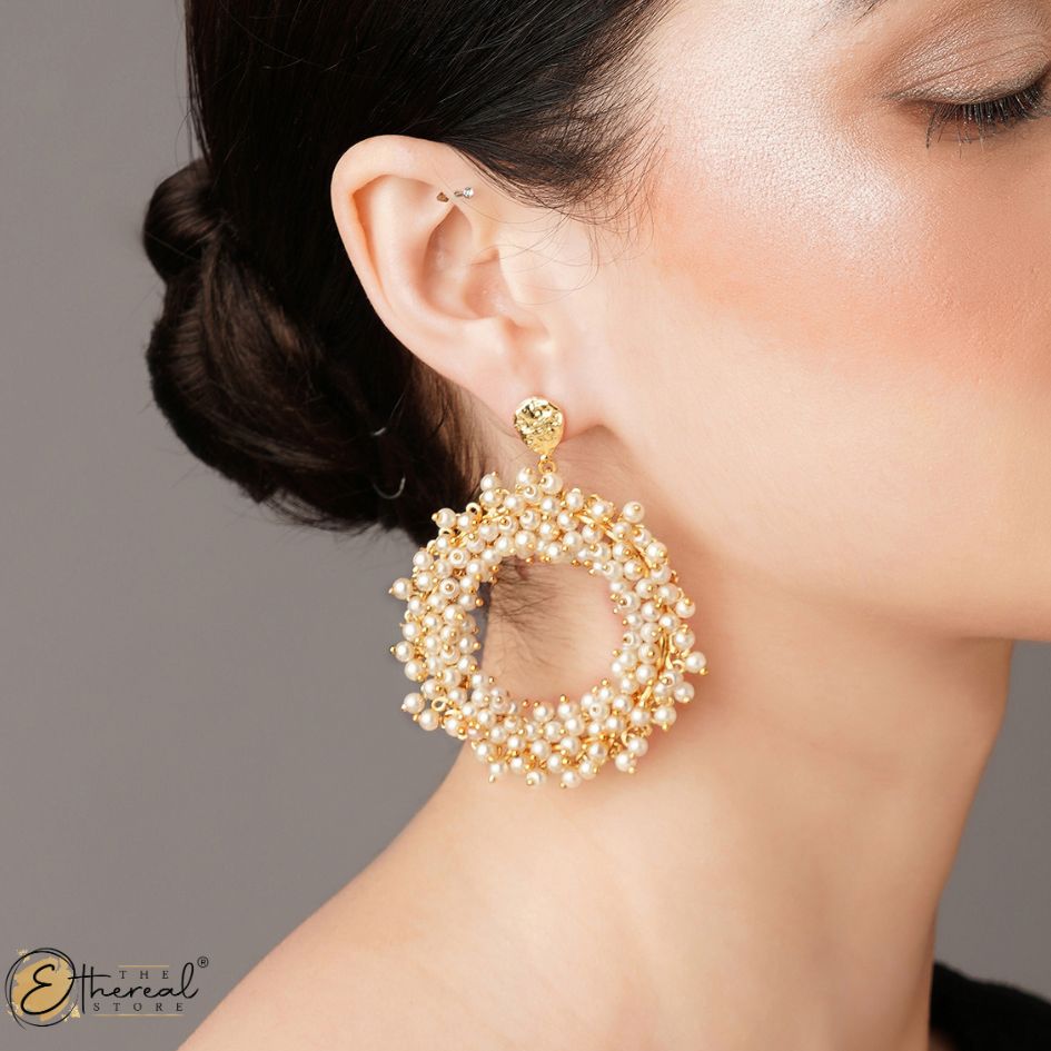 pearl earrings crafted in gold
