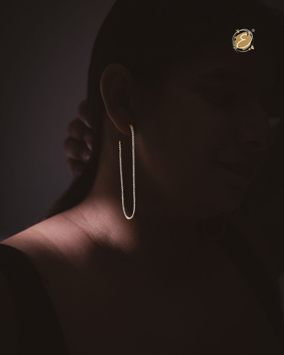 Bold statement silver hoop earrings with a sleek high-shine finish, handcrafted and silver-plated