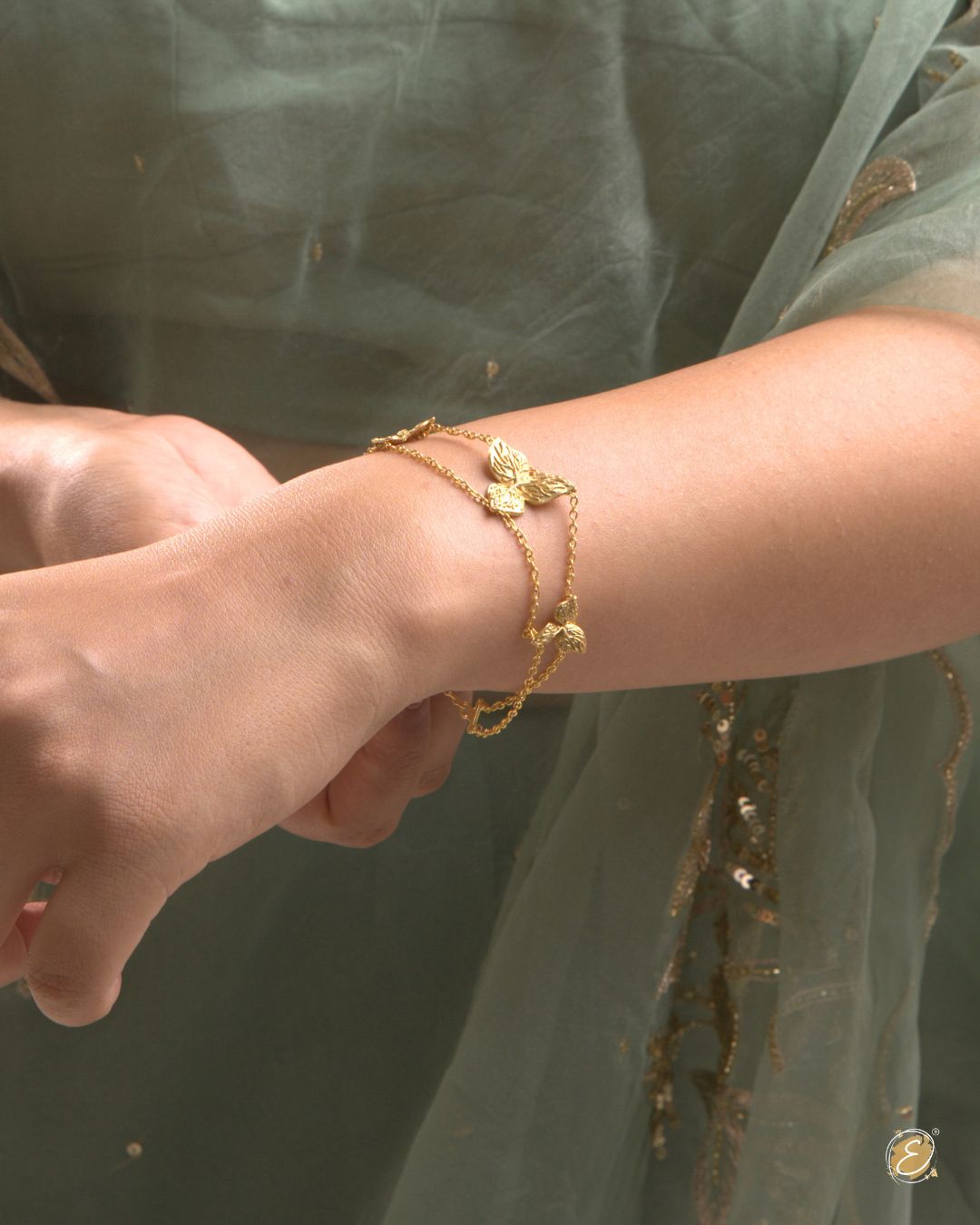 Gold-plated Zoya Flower Bracelet with three bougainvillea blooms on parallel link chains, adjustable fit.
