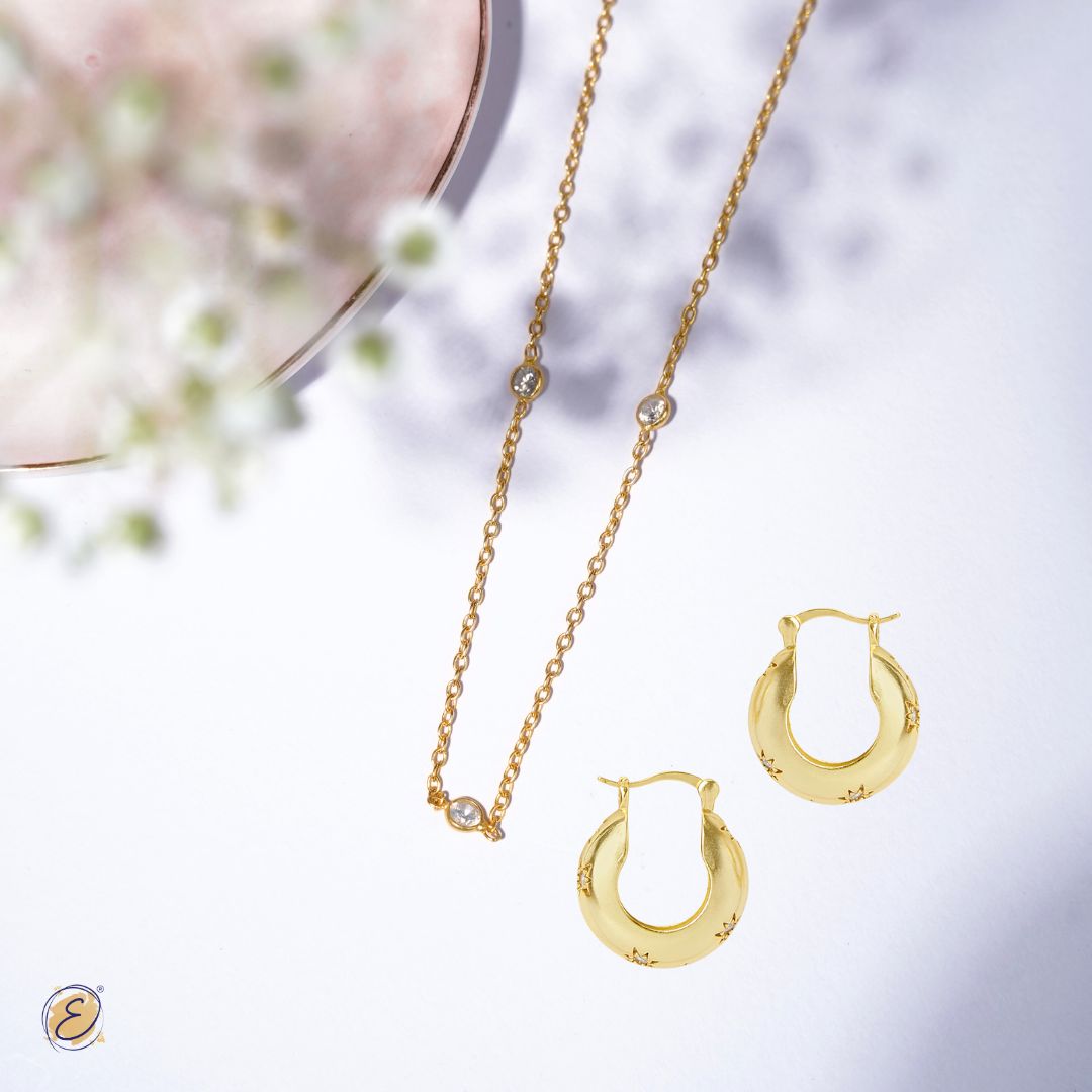 gold chain with gold earrings 