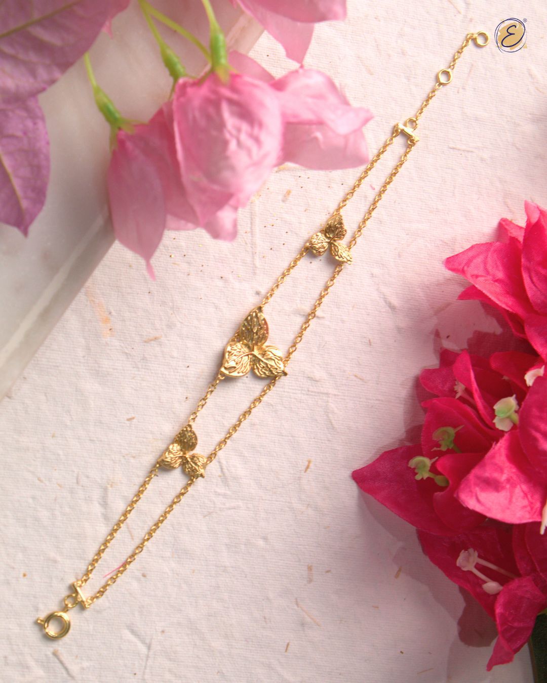 Gold-plated Zoya Flower Bracelet with three bougainvillea blooms on parallel link chains, adjustable fit.
